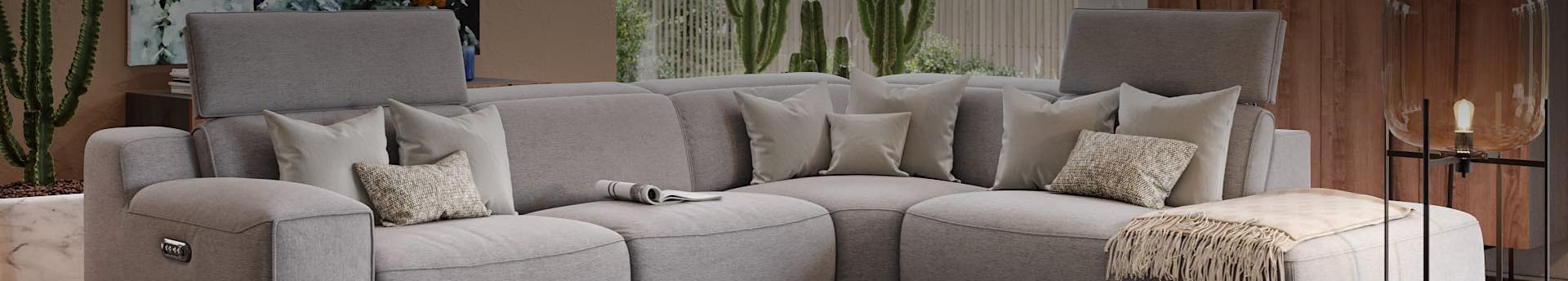 Moderne-Ecksofas-hochwertig Graues Ecksofa mit Kissen in modernem Wohnzimmer.